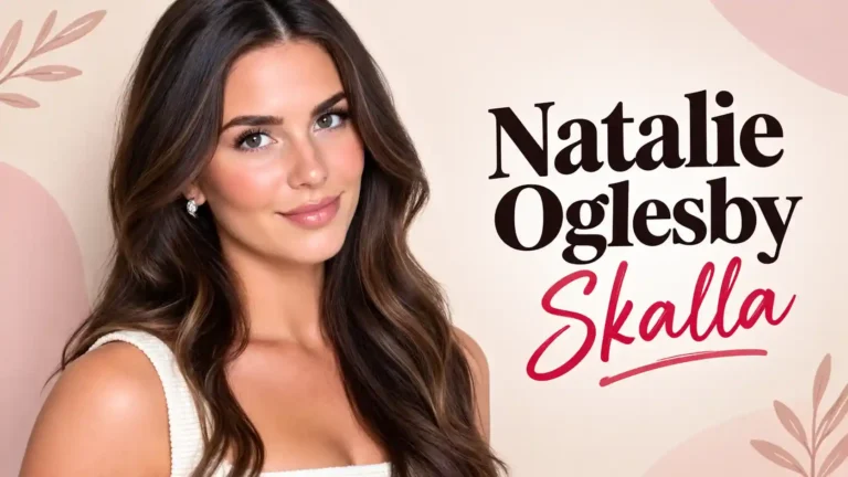 Natalie Oglesby Skalla smiling with long wavy brown hair in a white top